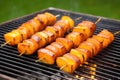 mango bbq plantains on a skewer over a smoky barbecue grill