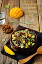 Mango black bean arugula pumpkin seed quinoa salad