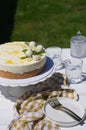 Mango and coconut cake on cake stand