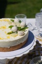 Mango and coconut cake on cake stand