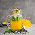 Mango, coconut and chia seeds pudding in glass jar Royalty Free Stock Photo
