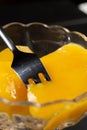 Mango Compote Closeup With Fork In The Mango