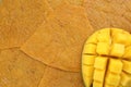 Mango on delicious fruit leather, top view. Space for text