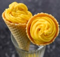 Mango ice cream served in waffle cone Royalty Free Stock Photo