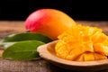 Mango fruit. Ripe Mango fruits on wooden table over black background