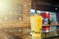 Mango fruity frappe, smoothies and shakes in plastic take away cup on the wooden table in beverage shop Royalty Free Stock Photo