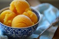 Mango ice cream, sorbet in a bowl on table, close up