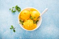 Mango ice cream, sorbet in a plate on a concrete background Royalty Free Stock Photo