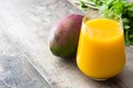 Mango Lassi dessert. Traditional Indian drink on wood