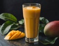 Mango lassi, a healthy smoothie with mango and yogurt, on a dark background.