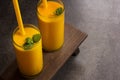 Mango Lassi Smooothie Juice with straw Overhead View Royalty Free Stock Photo