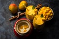 Mango Lassi or smoothie in big glass or small bottles with curd, cut fruit pieces and blender. Royalty Free Stock Photo