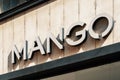Mango logo of the store. Mango is Spanish clothing design and manufacturing company, founded in Barcelona. Milan, Italy Royalty Free Stock Photo