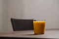 Mango lulo smoothie on walnut wood table with copy space Royalty Free Stock Photo