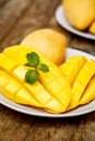 Mango and mint on a wooden table Royalty Free Stock Photo