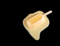 Mango or orange flavor popsicle in a melting process on black Royalty Free Stock Photo