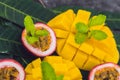 Mango and passion fruit on an old wooden background Royalty Free Stock Photo