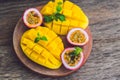 Mango and passion fruit on an old wooden background Royalty Free Stock Photo