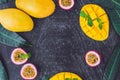 Mango and passion fruit on an old wooden background. Copy space Royalty Free Stock Photo