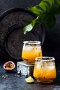 Mango passionfruit margarita cocktail with lime. Tropical alcoholic drink for summer