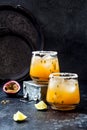 Mango passionfruit margarita cocktail with lime. Tropical alcoholic drink for summer