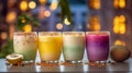 Mango, pistachio, blackberry and coconut lassis with decoration and a cozy blur background