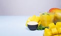 Mango Shake wit Maca on Blue Background. Healthy Drinking Vitamin Smoothie. Fresh Tropical Mango Fruit Juice. Space for Royalty Free Stock Photo