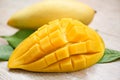 Mango slice and mango leaves from tree tropical summer fruit concept - Sweet ripe mangos cut half Royalty Free Stock Photo