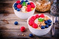 Mango smoothie bowls with raspberries, blueberries, chia seeds and granola Royalty Free Stock Photo