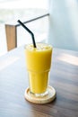 mango smoothie glass in cafe Royalty Free Stock Photo