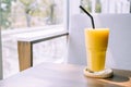mango smoothie glass in cafe Royalty Free Stock Photo