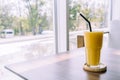 mango smoothie glass in cafe Royalty Free Stock Photo