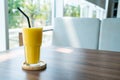 mango smoothie glass in cafe Royalty Free Stock Photo