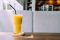 mango smoothie glass in cafe Royalty Free Stock Photo