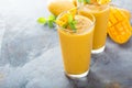 Mango smoothie in tall glasses Royalty Free Stock Photo