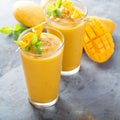 Mango smoothie in tall glasses Royalty Free Stock Photo