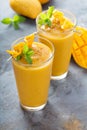 Mango smoothie in tall glasses Royalty Free Stock Photo