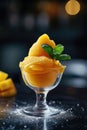 Mango sorbet in a glass on the table . Popsicle in a glass