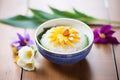 mango sticky rice with edible flower decoration