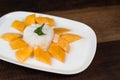 Mango sticky rice or Khaoniao mamuang on a wooden table