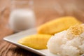 Mango with Sticky Rice on wood table