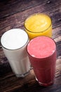 Assorted smoothies over a table Royalty Free Stock Photo