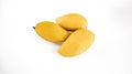 Mango Thai Nam Dok Mai Mango show in three lay down.jpg yellow mangoes against a white background. The mangoes look plump and fres Royalty Free Stock Photo