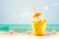 Mango sherbert or ice cream in transparent glass with straw on blurred seascape background