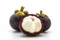 Mangosteen,cross section showing the thick purple skin.