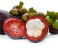 Mangosteen and cross section showing the thick purple skin and w