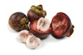 Mangosteen cross section showing thick purple skin and white flesh the queen of friuts.