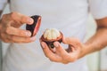 Mangosteen on farmer hand hold tropical fruit Royalty Free Stock Photo