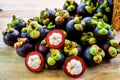 Mangosteen fruit in the basket on wooden table
