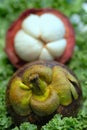 Mangosteen fruit top of stem outside and cross section inside sh